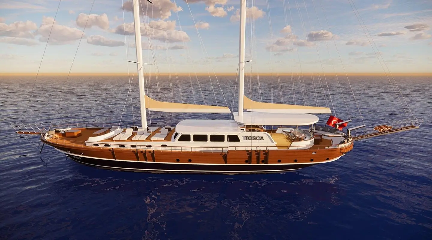 Tosca luxury gulet sailing at sunset with wooden hull and white sails