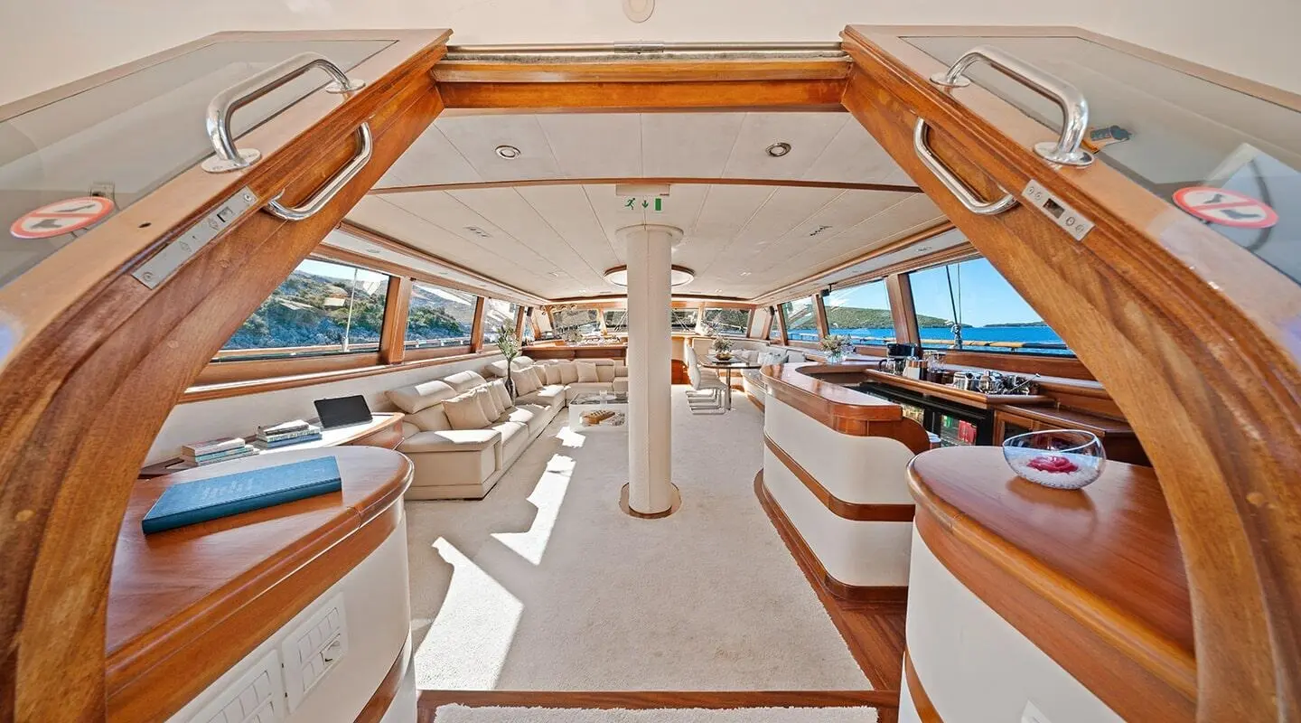 Alessandro I yacht cockpit view with seating, helm, and sunlit deck
