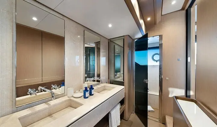 Spica yacht master cabin with king bed, ensuite, modern wood tones