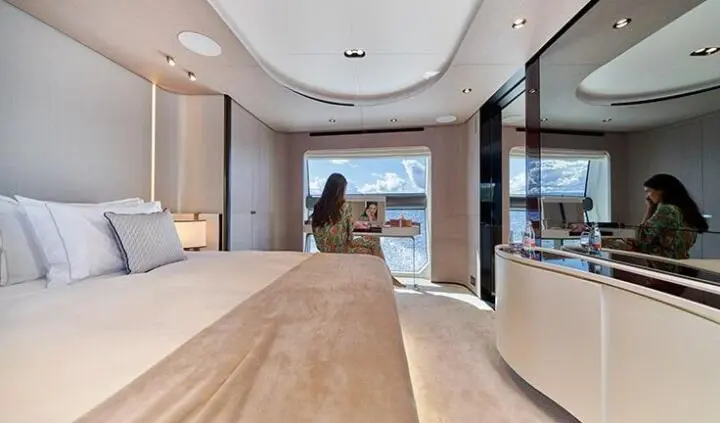 Master cabin with king bed, wooden accents, ensuite door, soft lighting