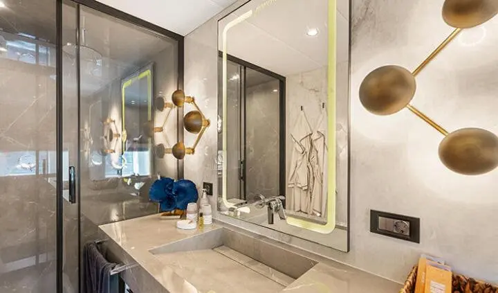 North Wind master cabin with king bed, ensuite, modern vanity and mirror