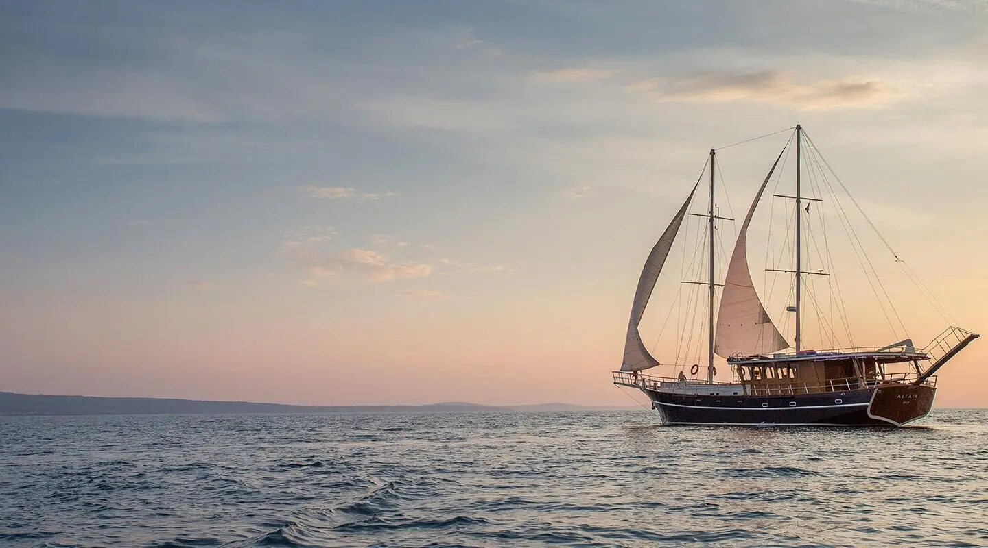 Altair gulet sailing yacht on open sea at sunset