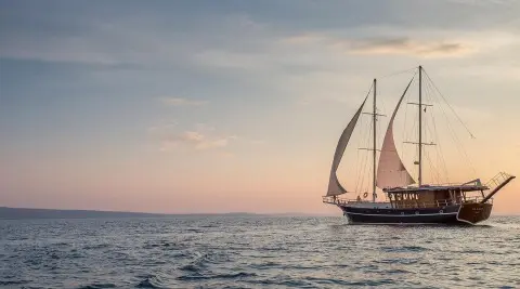 Altair gulet sailing yacht on open sea at sunset