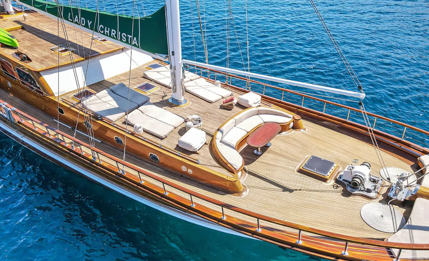 Yacht Lady Christa on calm sea with seating area and sun loungers on deck