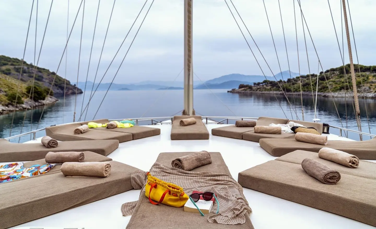 On the yacht Tersane 8, sunlit deck with loungers and calm blue sea