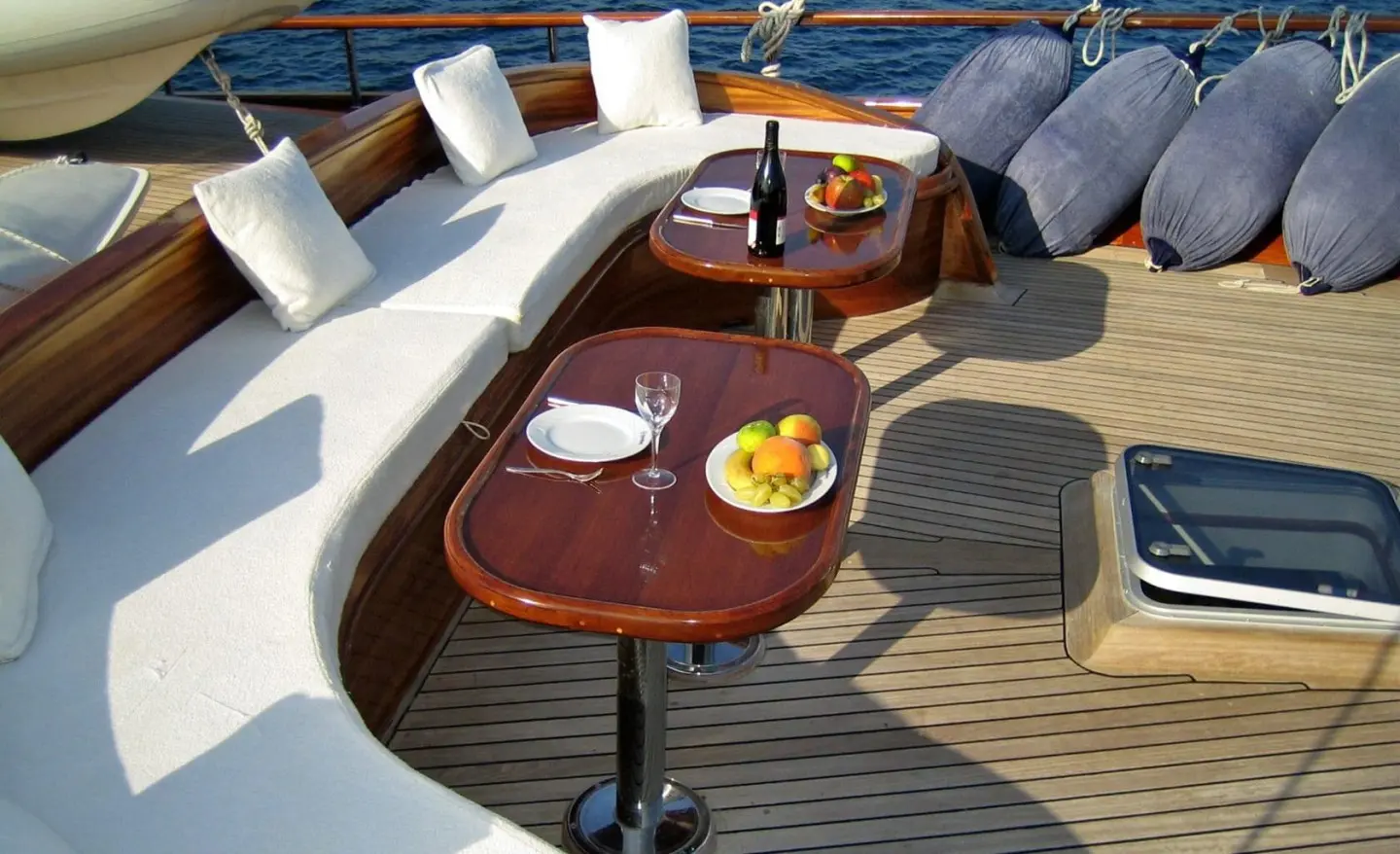 Aft deck of Kaya Guneri 4 gulet with a wooden table set for two