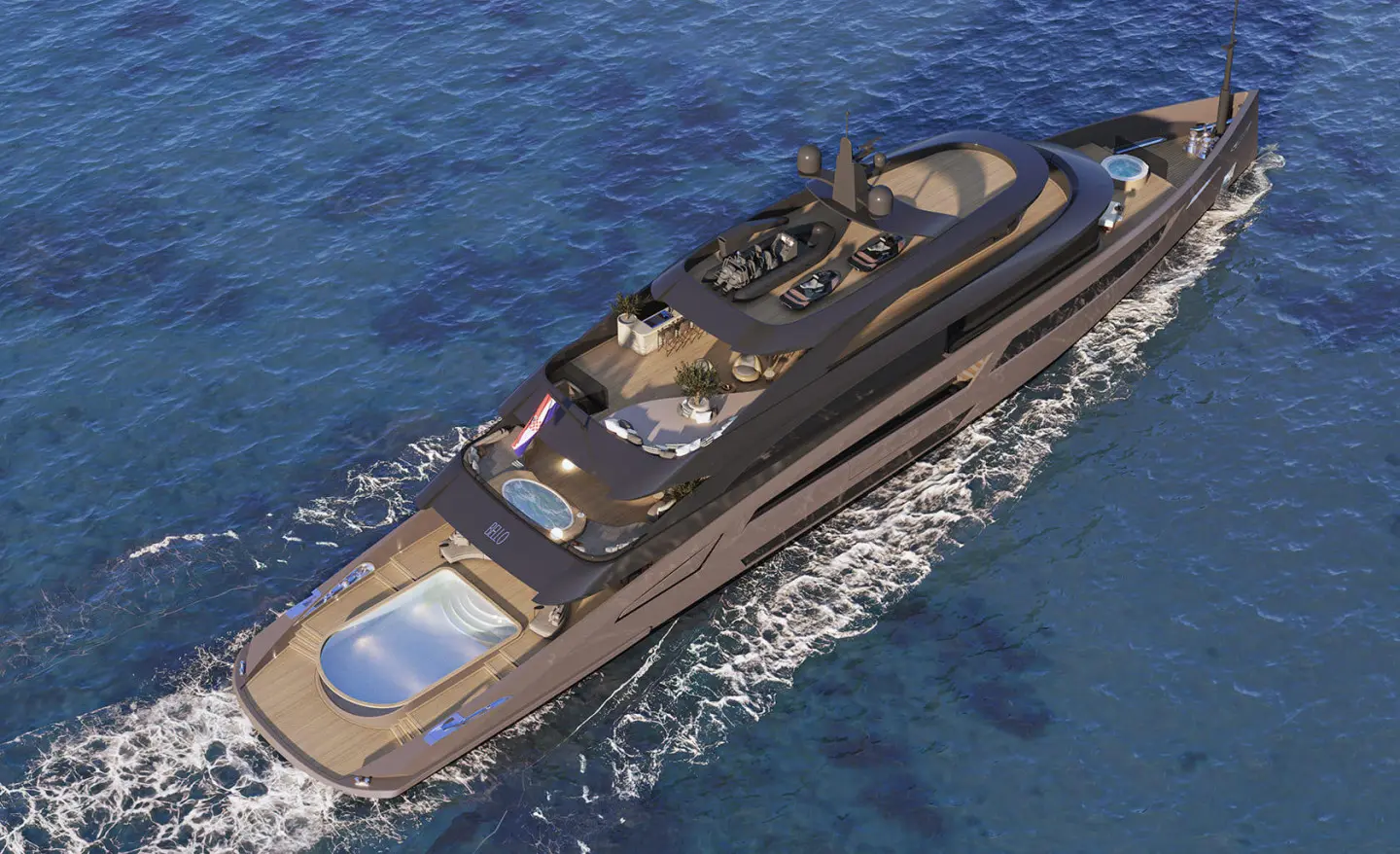 Aerial view of a sleek luxury yacht Bello cruising through blue sea