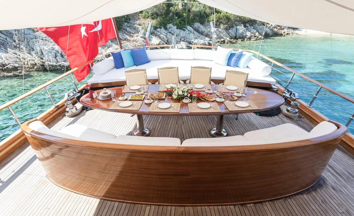 Grace 1 aft deck on a gulet with cushioned seating and wooden deck