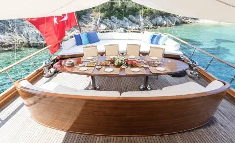Grace 1 aft deck on a gulet with cushioned seating and wooden deck