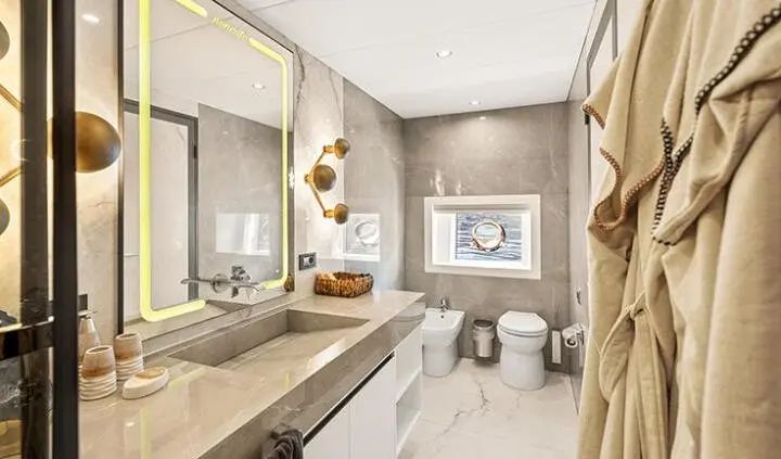 North Wind yacht master cabin with king bed, ensuite, neutral tones, window view