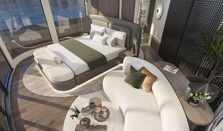 Master cabin on Bello yacht with king bed, ensuite and seating area