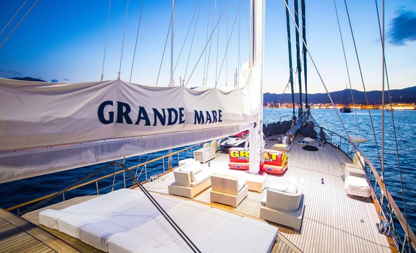 Grande Mare yacht deck with seating and sun view at sunset on calm sea