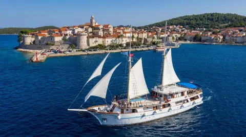 Mendula sailing gulet yacht seen on blue sea near coastline
