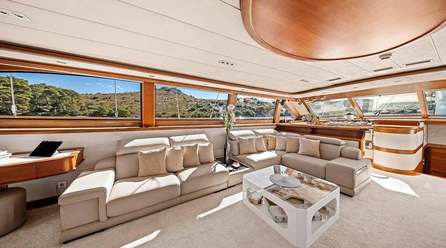 Alessandro I yacht deck with white seating, sun loungers, and sunset view