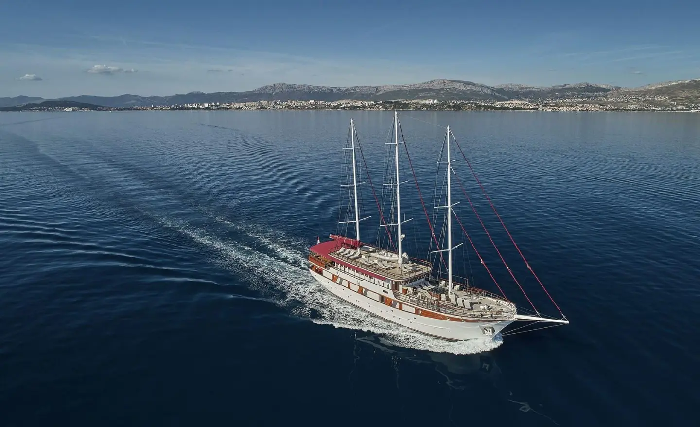 Luxury sailing yacht Amorena anchored on calm blue sea, clear sky