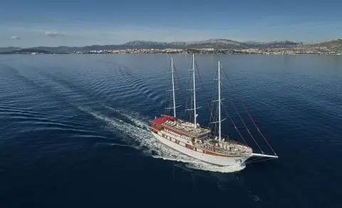 Luxury sailing yacht Amorena anchored on calm blue sea, clear sky