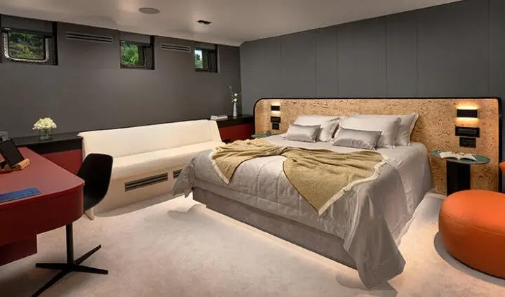 Master cabin with king bed, ensuite look, soft lighting and neutral tones