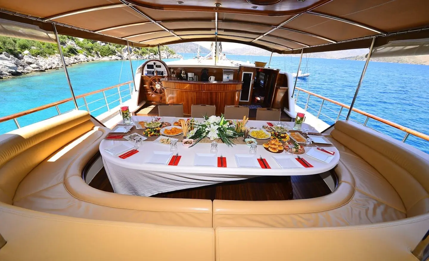 Prenses Bugce yacht table set for dining on deck at sunset