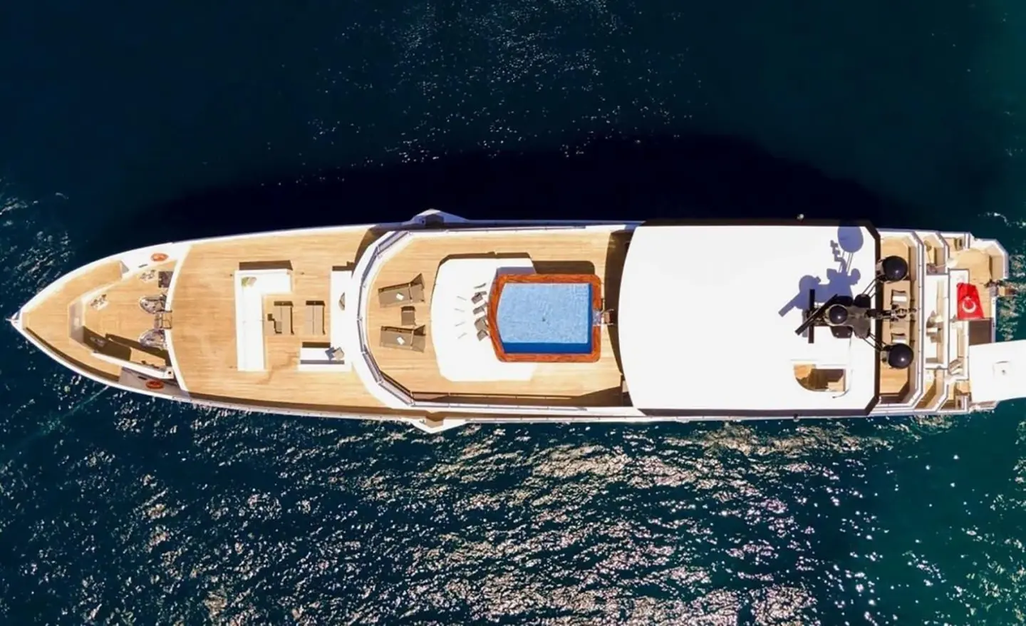 Top-down view of Ocean Breeze yacht deck with seating and swim platform
