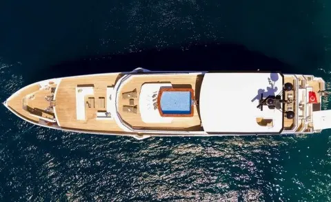Top-down view of Ocean Breeze yacht deck with seating and swim platform
