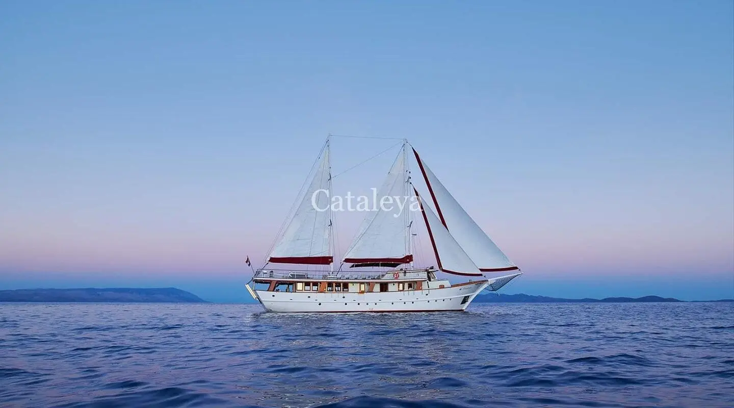 Sailing yacht Cataleya on calm open sea with two masts and white hull