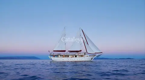 Sailing yacht Cataleya on calm open sea with two masts and white hull