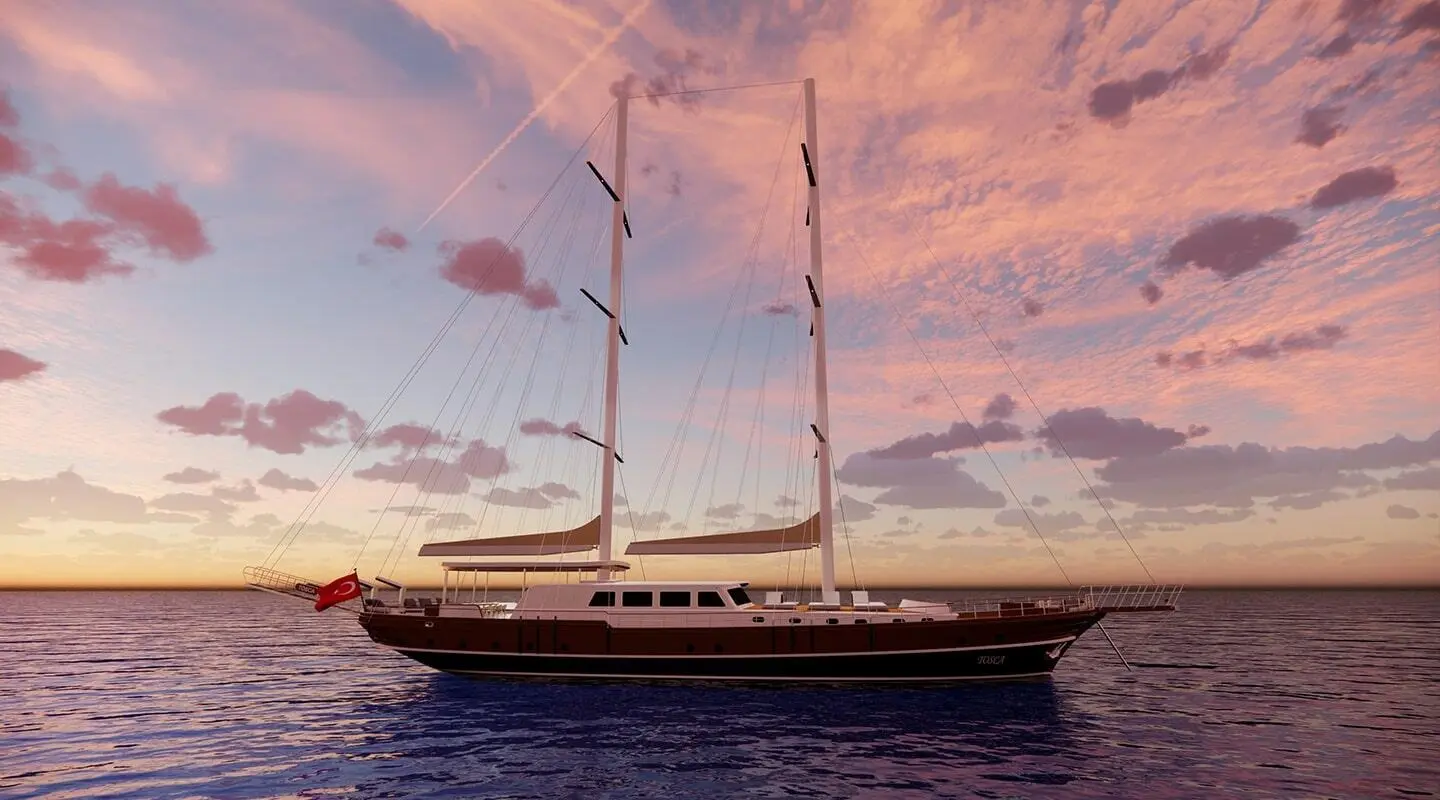 Tosca luxury yacht anchored at sunset with sails up and calm waters