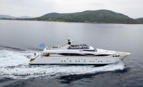 Pareaki II luxury yacht cruising coastal waters with island backdrop