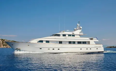 Idylle yacht on calm waters, sleek white motor yacht profile