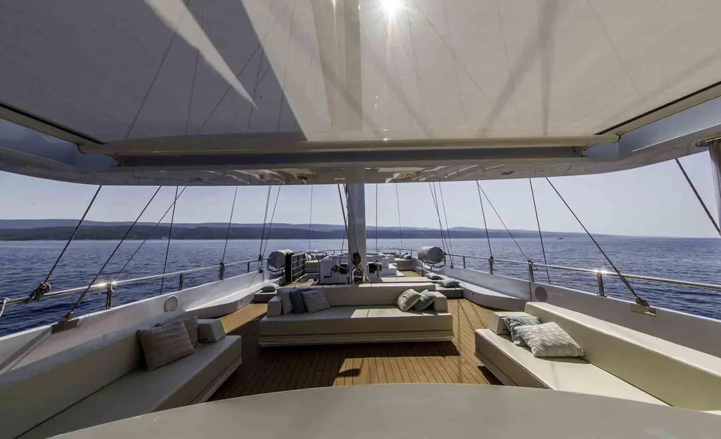Omnia yacht deck with seating areas and open sea view