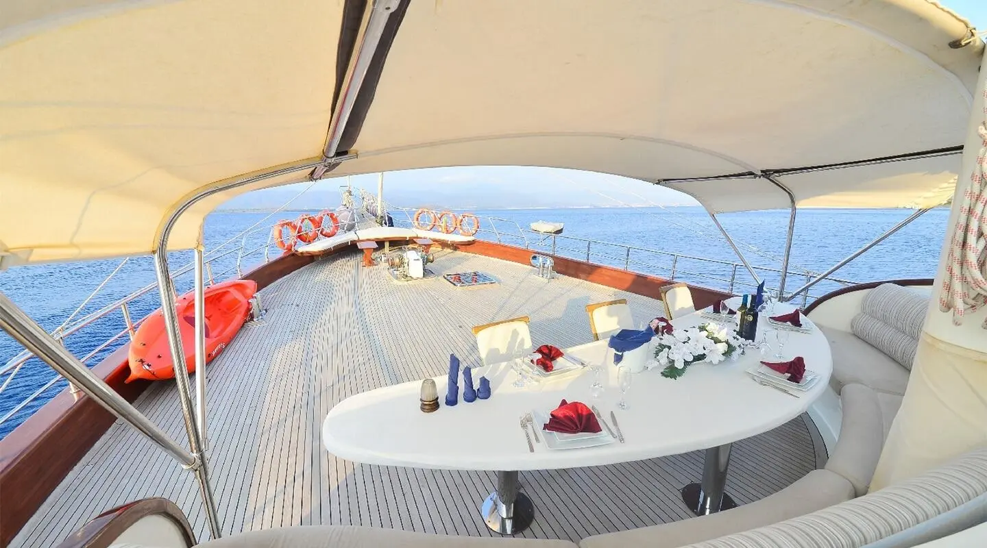 Sunset sail on Berrak Su yacht with deck seating and lifebuoys visible