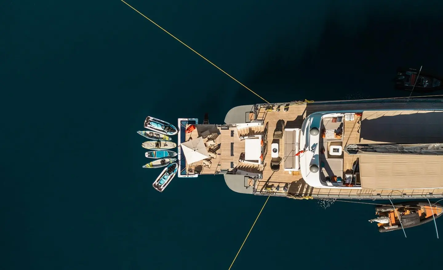 Top-down view of a luxury yacht named North Wind docked at a marina
