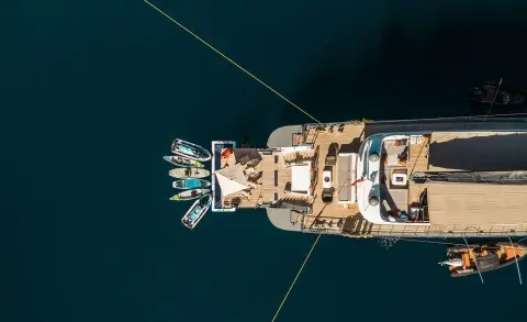 Top-down view of a luxury yacht named North Wind docked at a marina