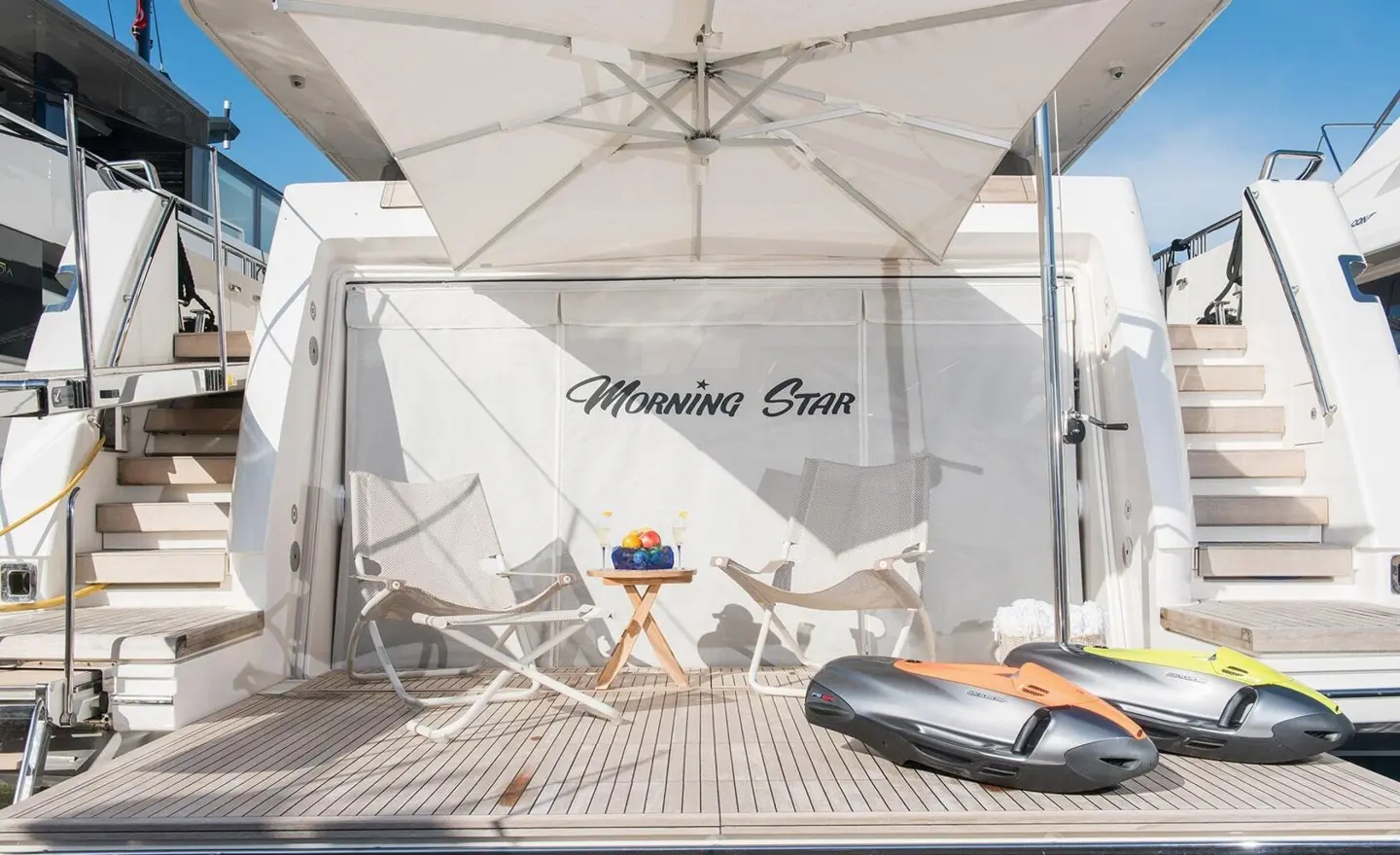 Morning Star yacht stern swim platform with deck chairs and a lifebuoy