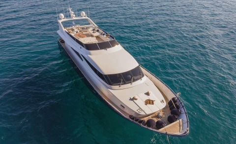 Zoi yacht in open sea, upper deck lounge area and bow with seating visible
