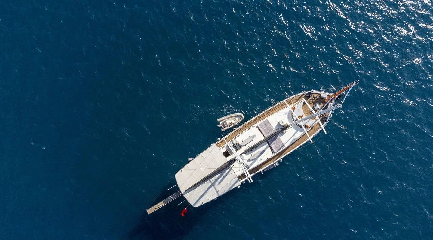 Aerial view of Diva Deniz gulet yacht anchored in deep blue water