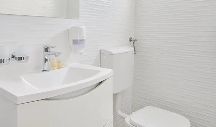 Compact yacht master cabin with king bed, ensuite, white fixtures