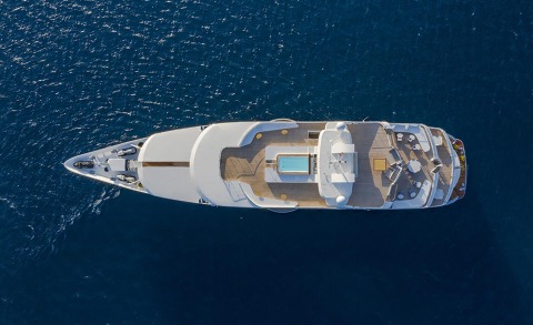 A luxury yacht's upper deck seen in the open sea with a small pool