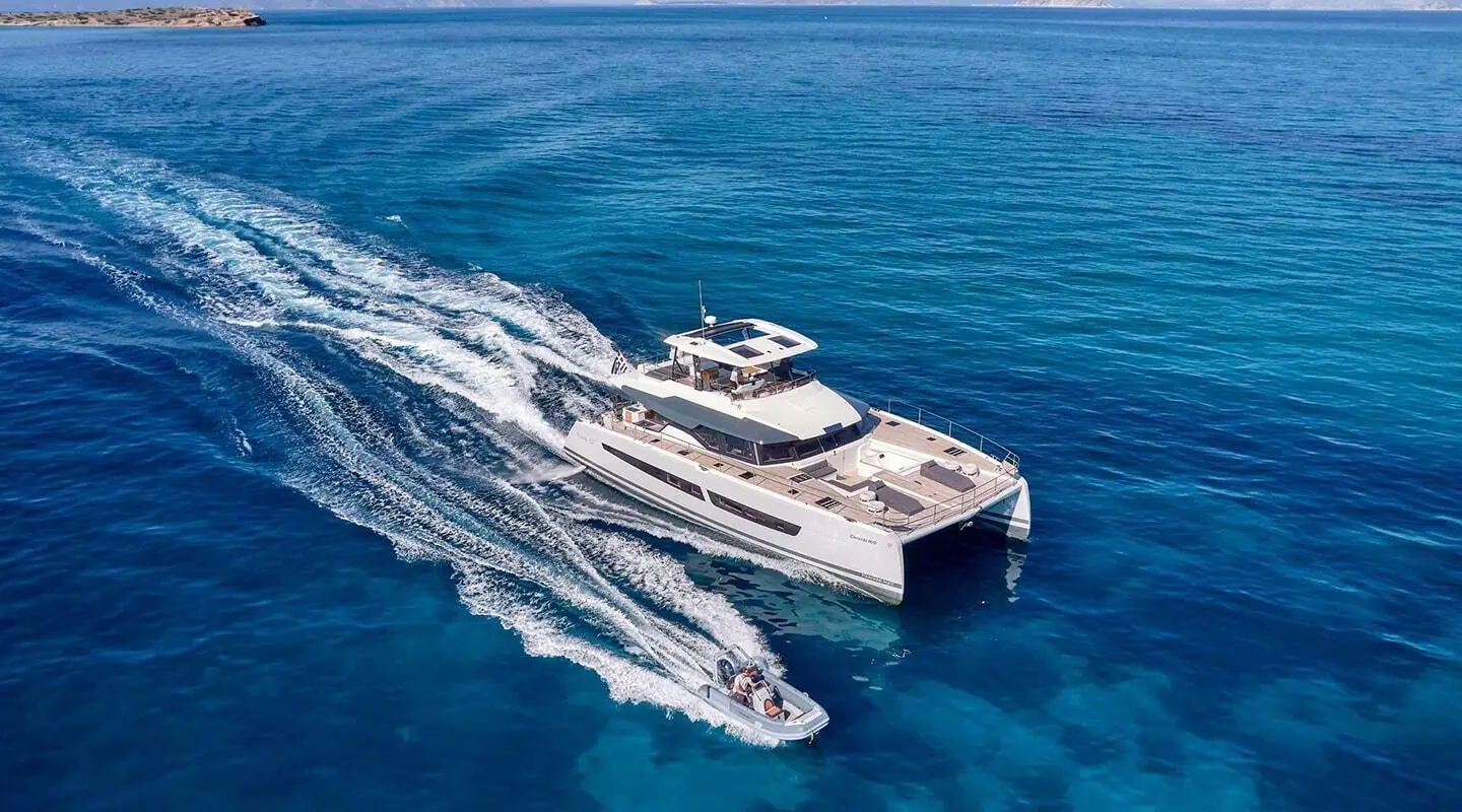 Overhead view of Christal Mio yacht cruising, wake trailing at sea