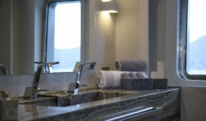 Master cabin with king bed and ensuite bathroom on All About U 2 yacht