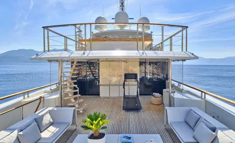 La Pellegrina 1 yacht lounge on deck at sunset with seating and plants