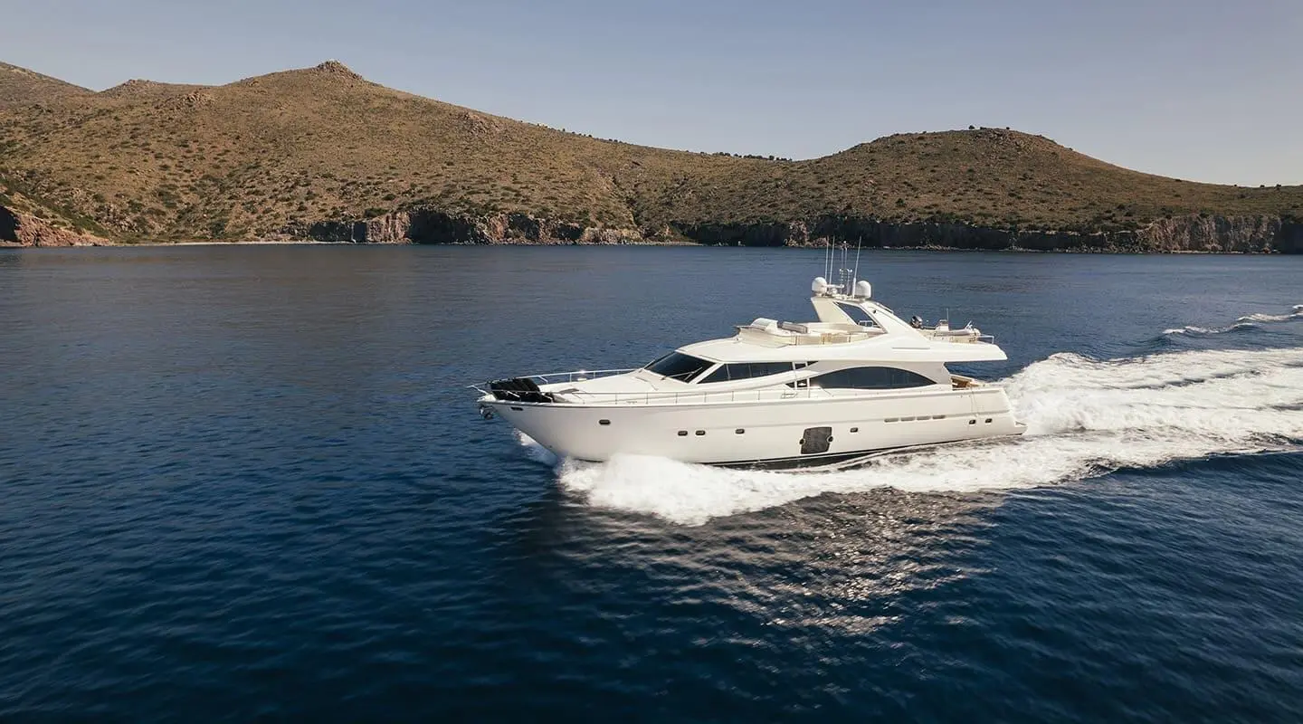 Lidia luxury motor yacht cruising along rocky coastline at sea