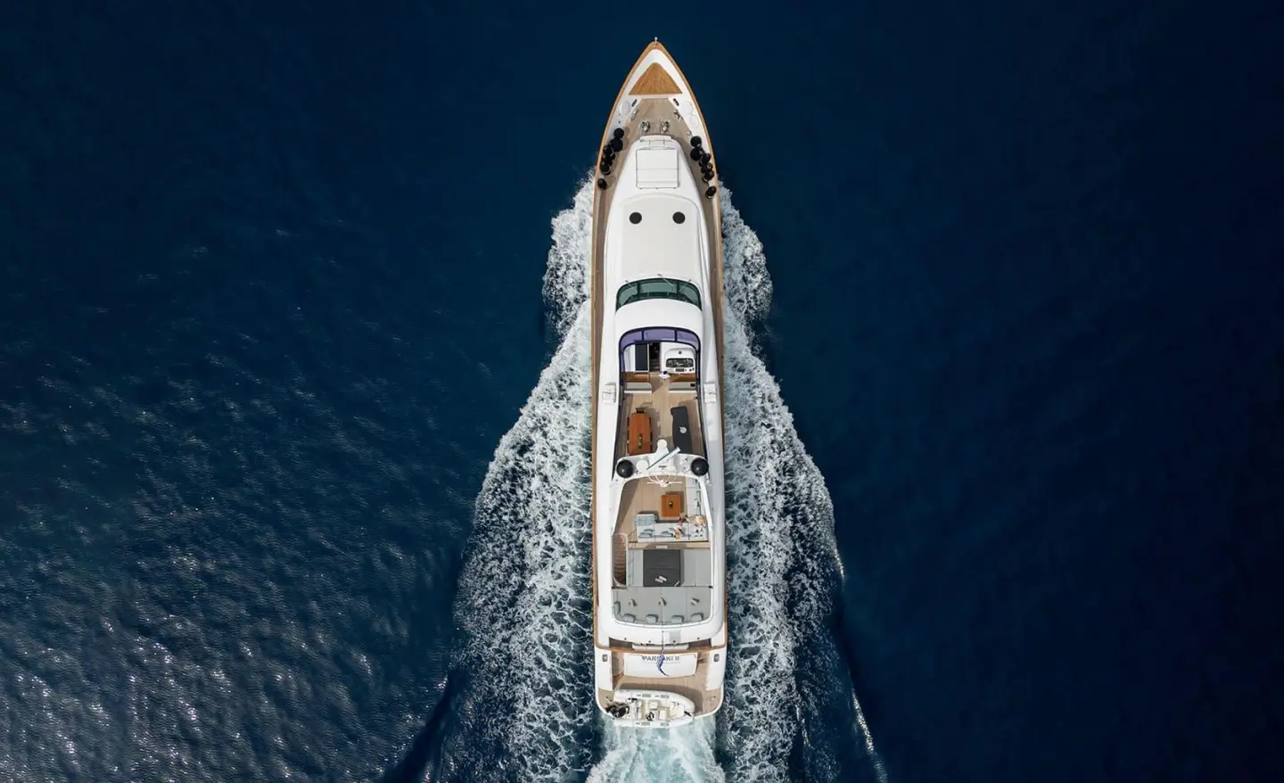 Pareaki II luxury yacht sailing on blue sea, aerial view from above
