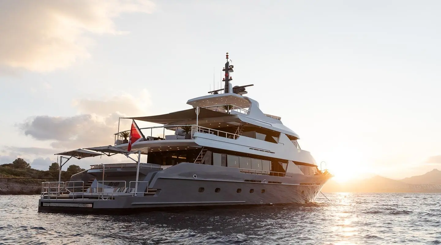 Sunset view of a large yacht Illusion II anchored at sea