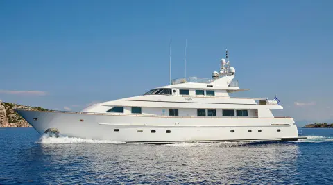 Idylle luxury yacht anchored on calm blue water with clear sky