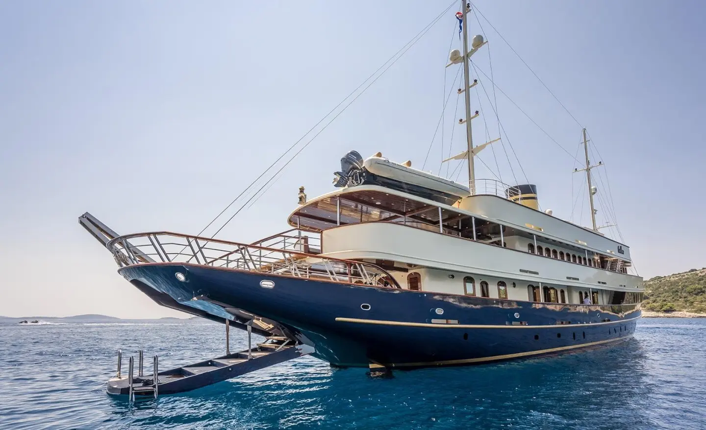 Casablanca yacht anchored, blue hull and white superstructure in clear water