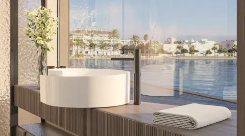 Bello luxury yacht bathroom with round freestanding tub and ocean view