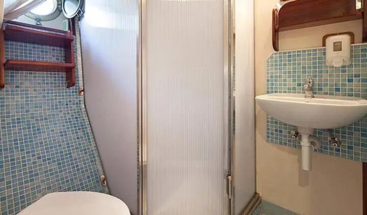Cabin ensuite bath with sink aboard Tajna Mora yacht, compact interior view