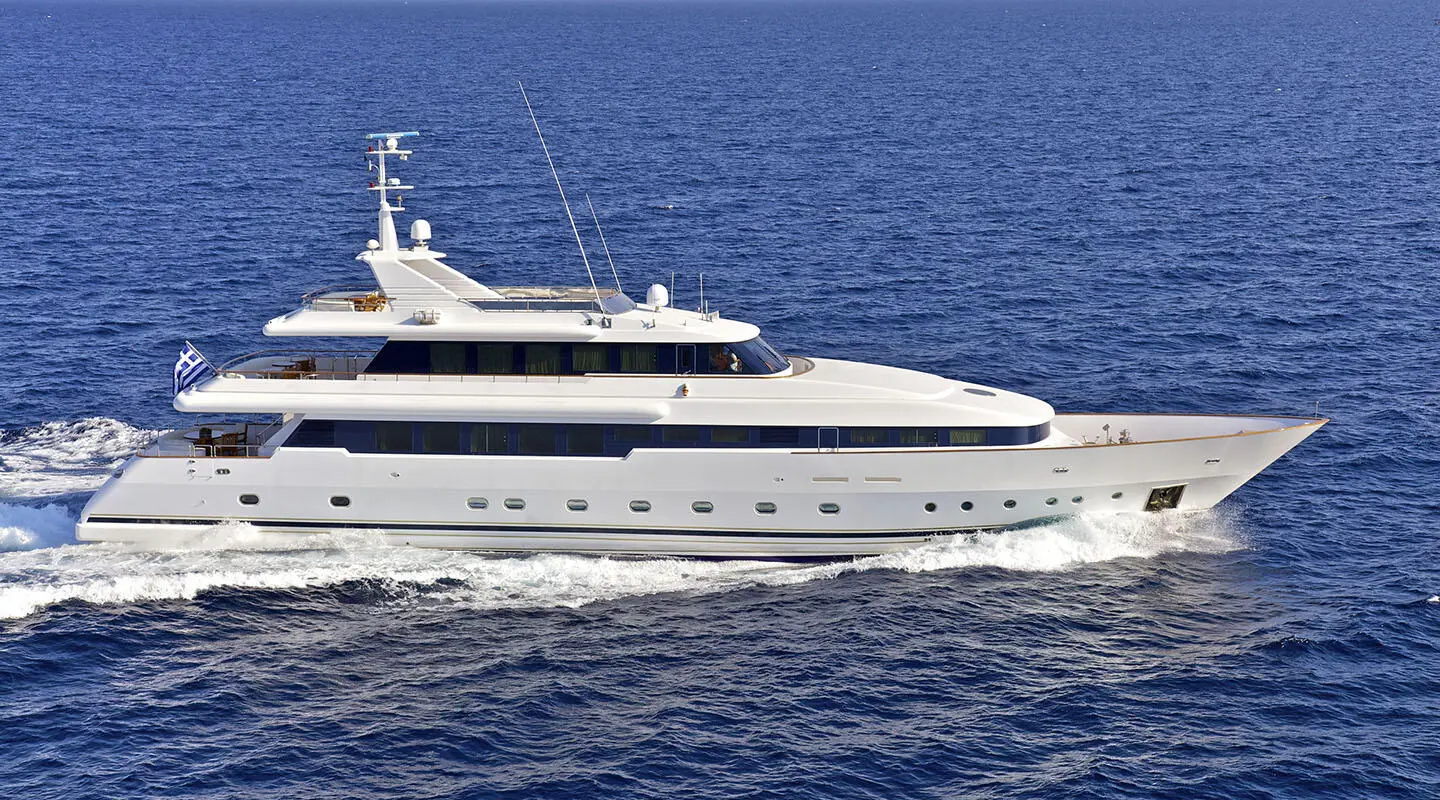 Luxury yacht O'Rion cruising on calm blue sea, white hull and decks