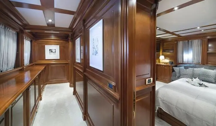 Aquila cabin wooden ensuite area with polished wood panels and doorway